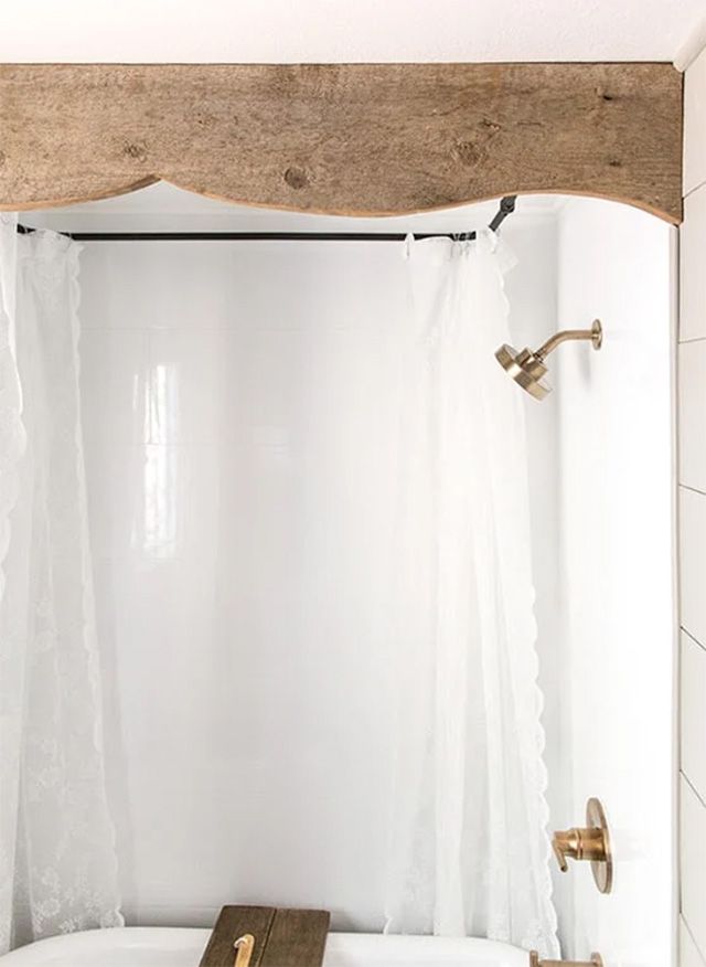A wooden valance above a shower